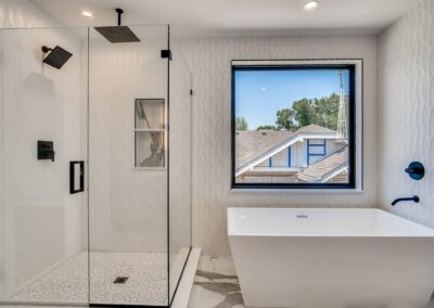 a bathroom with a shower area and a bathtub